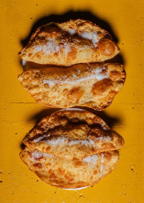 Crispy empanada de viento with its signature puffed shell.