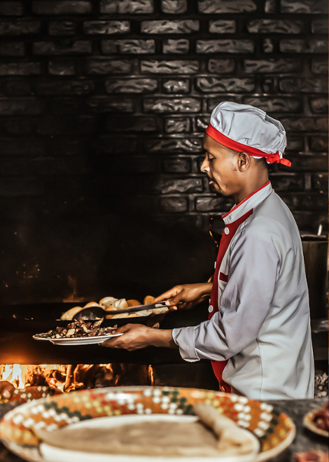 Cooking meat over open flames