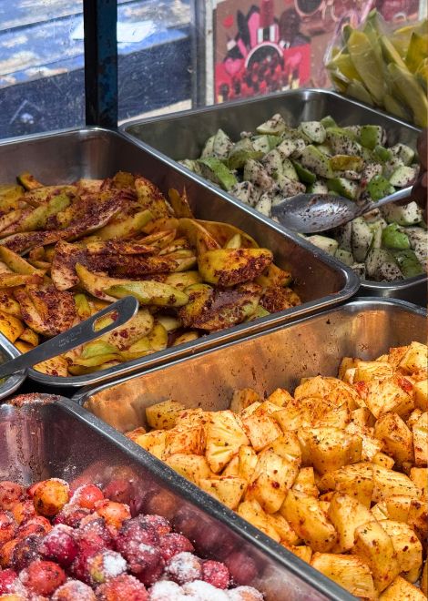 A street vendor serving up colourful, punchy acharu.