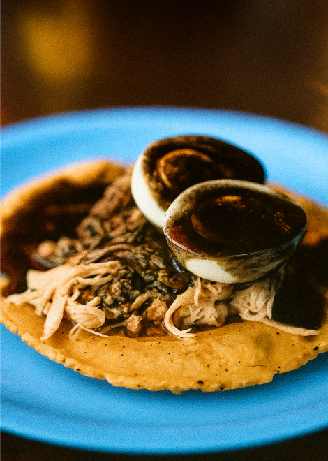 A Merida speciality, rellango negro shredded turkey on a crispy panucho 