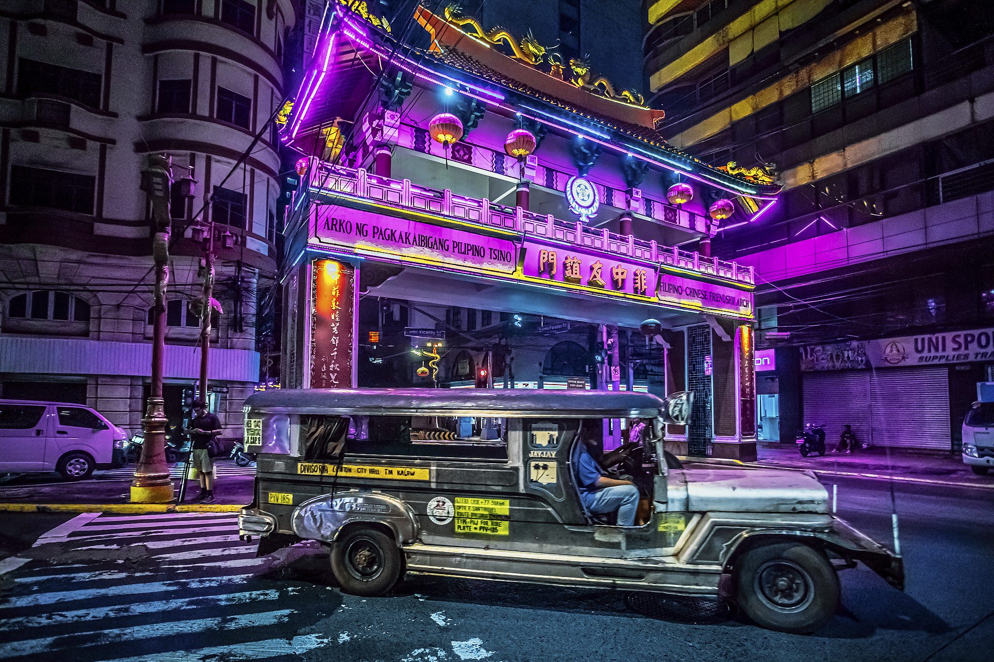 Jeepneys chugging along by night