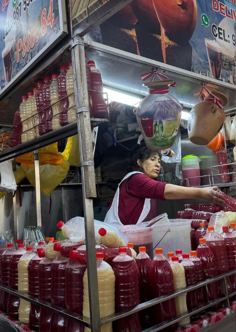 Traditional emoliente and herbal market drinks served from the stall