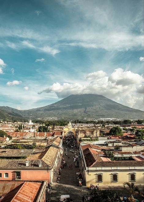 Antigua's terracotta rooftops beneath the watch of its volcanoes.