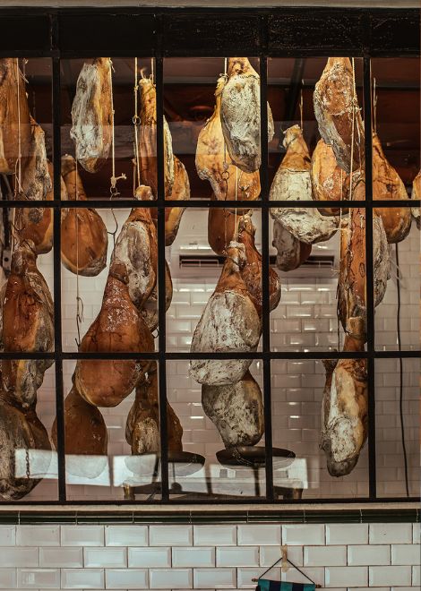 Time, salt, and patience transform these house-cured hams into one of the bar's most celebrated specialties