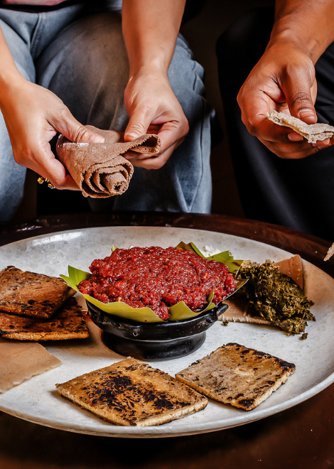 Kifto,  minced beef with warming mitmita, cottage cheese and kale