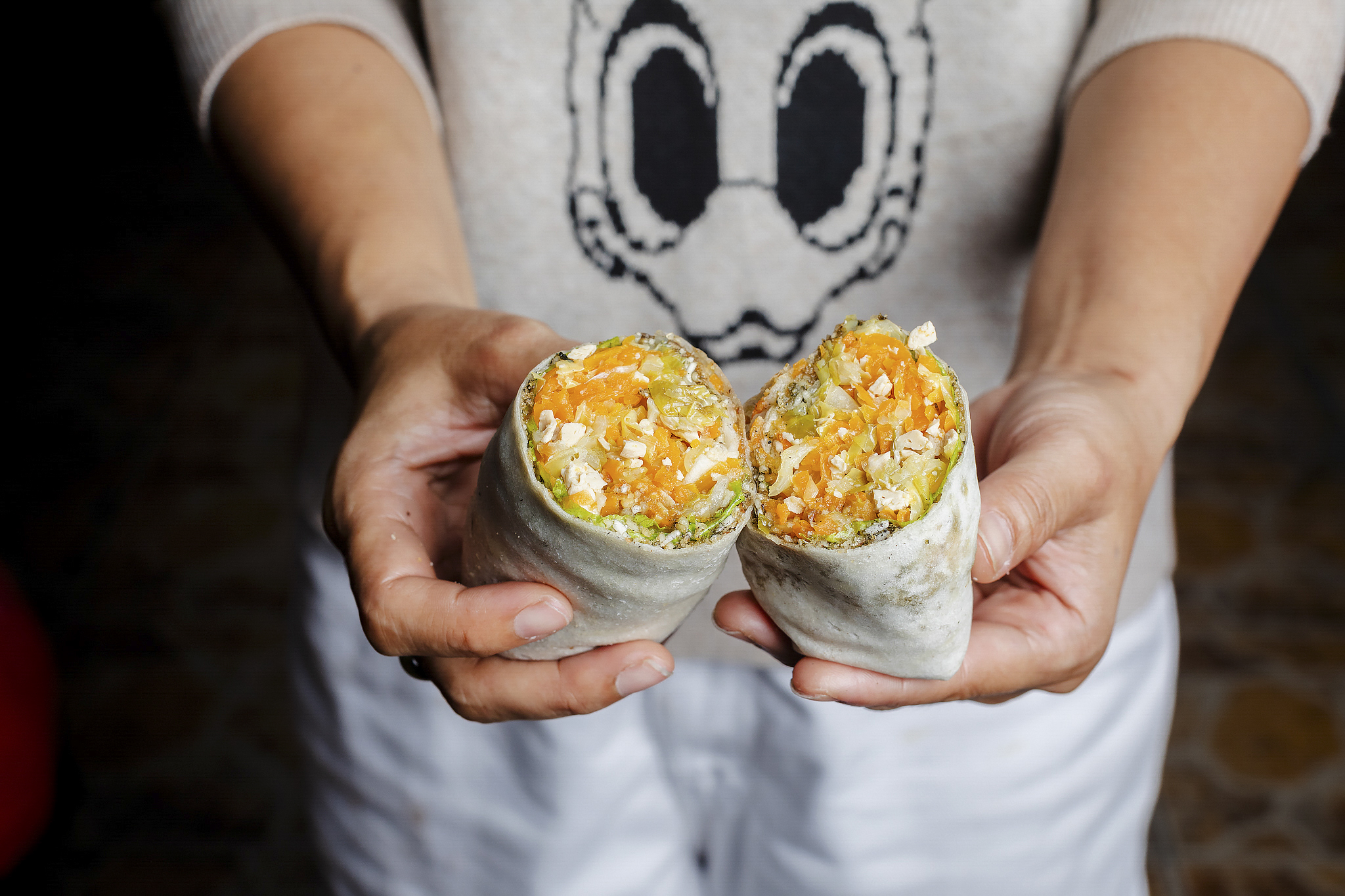 Break open delicious lumpia rolls at Carvajal Street