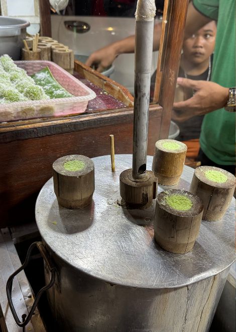 Freshly steamed kue putu infused with fragrant pandan.