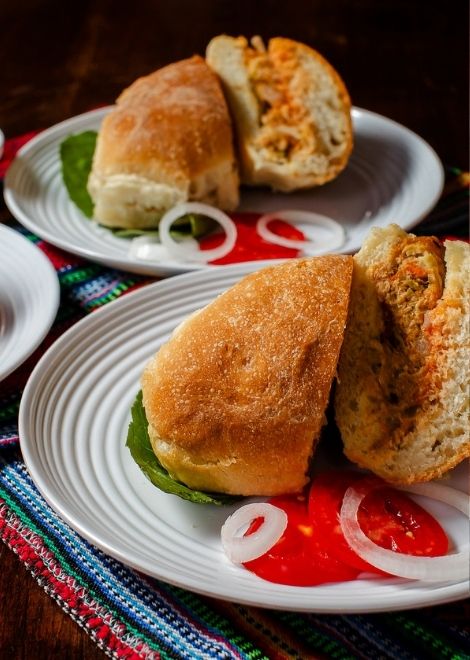 Stuffed chile relleno tucked into a crusty bread roll.