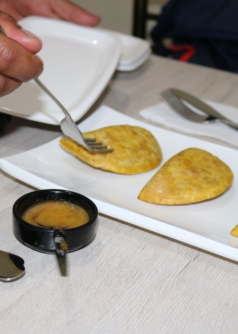 Fried empanadas with picante aji sauce