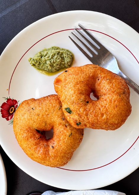 Golden ulundu vadai with fiery kochchi sambol.