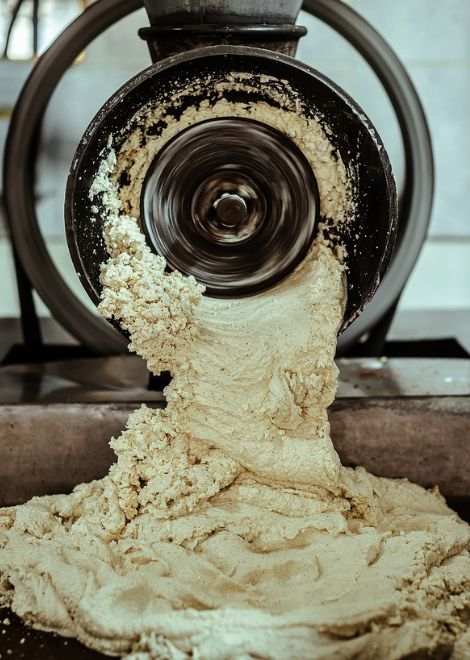 Traditional corn masa being prepared from scratch.