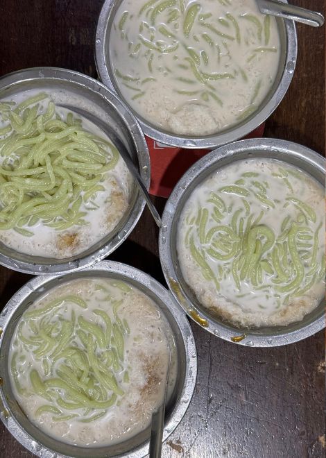 A bowl of silky cendol layered with rich palm sugar and coconut milk.