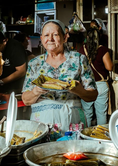 A tamale vendor at work in the heart of the market.