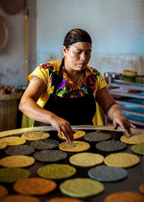 Colourful corn tortillas warming on the comal.