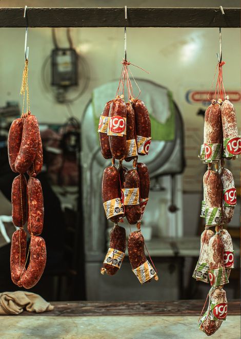 Rows of hanging sausages reflect the European traditions that helped shape the food culture of Buenos Aires