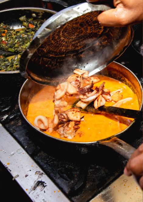 Creamy ngisi wa nazi, calamari simmered in fragrant coconut curry.
