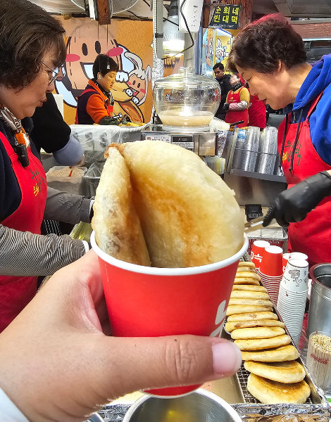 Bite into sugar dusted hotteok pancakes en-route to Ikseon-dong