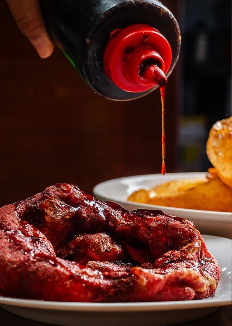 Picarones, Peru's answer to the doughnut, made from sweet potato and squash and drizzled with warm syrup
