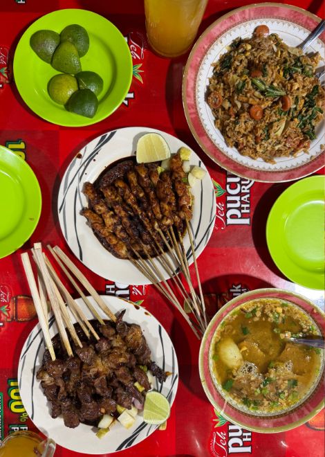 Smoky sate with rich peanut sauce, and warm soto madura.