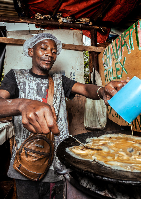 Vendor cooking the iconic chapati and omelette Rolex