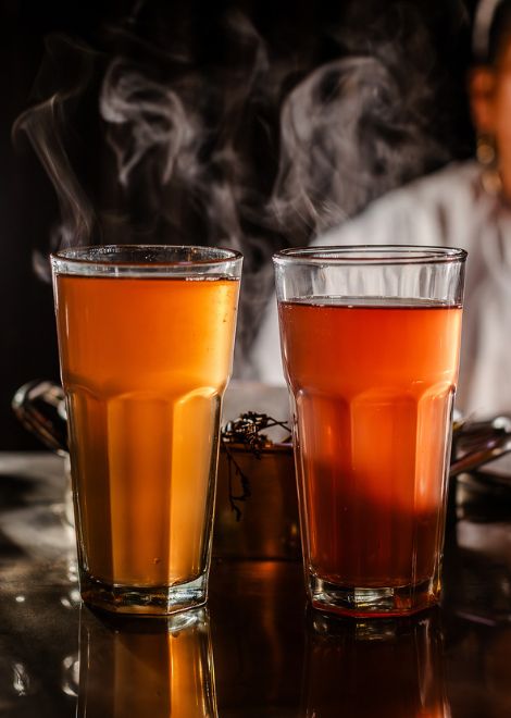 A warming glass of emoliente digestivo, a traditional Peruvian herbal drink enjoyed for generations