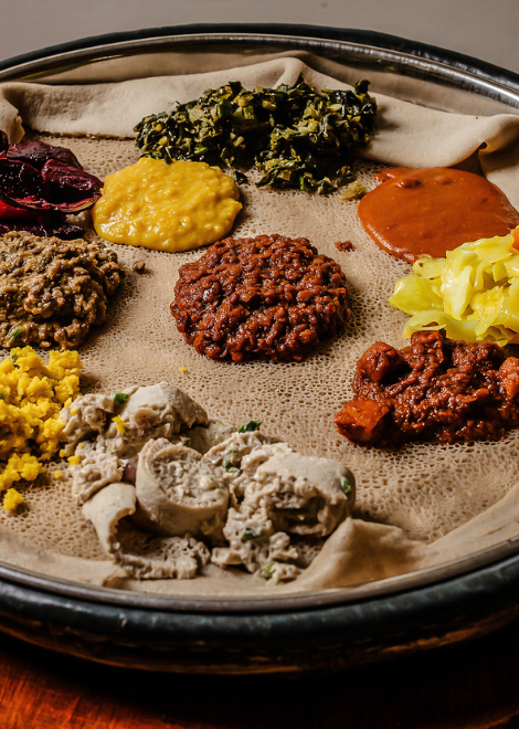 Mixed vegetarian beyaynetu on injera
