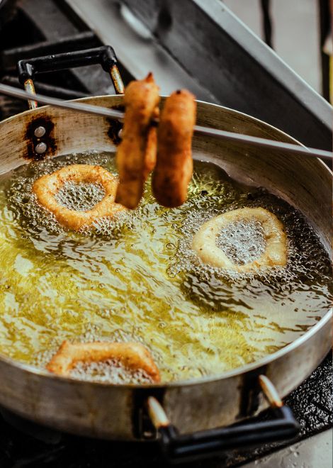 Freshly made buñuelos, a light and airy Peruvian fritter with a hint of anise.