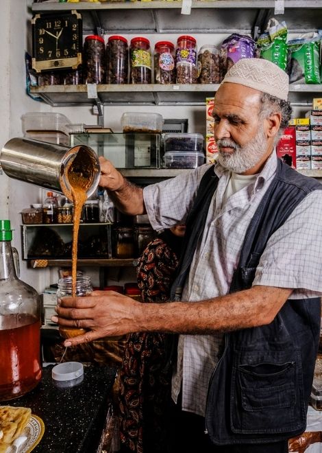 Wild honey vendor in the main market