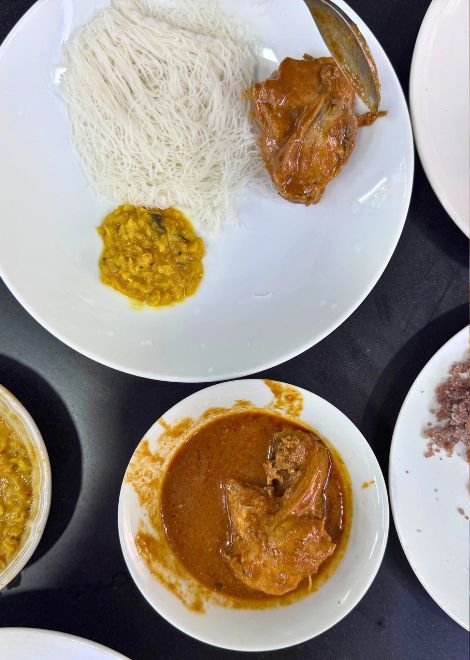 String hoppers and pittu with creamy dhal and fragrant kukul mas curry.