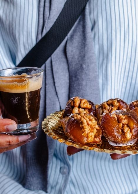 Locally roasted coffee and walnut-stuffed Moroccan dates