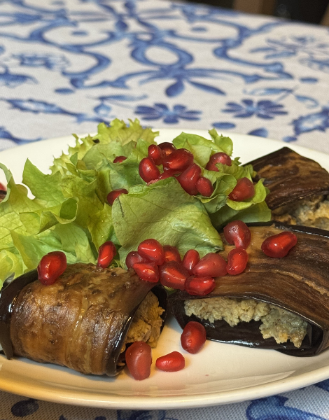 A Georgian delicacy, eggplant walnut rolls littered with pomegranate seeds