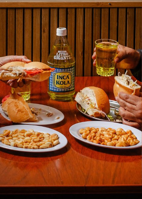 A classic butifarra paired with an ice-cold Inca Kola