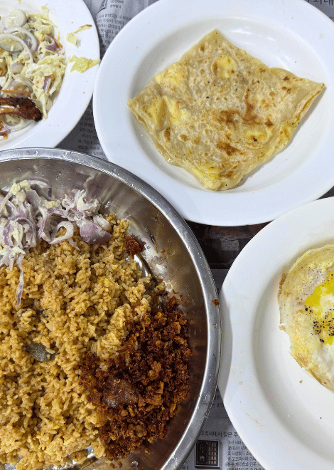 Fragrant chicken biryani with golden, cheese-filled parathas.