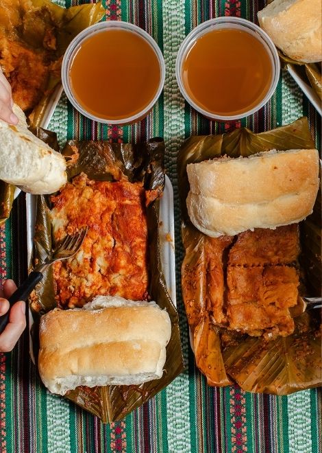 Unwrap a steaming tamal de cerdo, packed with tender pork.