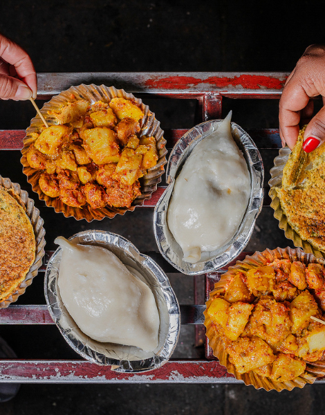 Crispy pancakes dunked in a potato curry