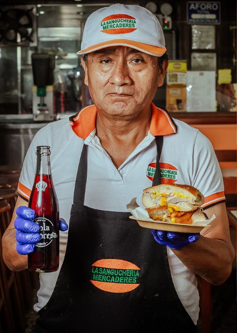 A traditional lechón sandwich served with Arequipa's beloved Cola Escocesa.