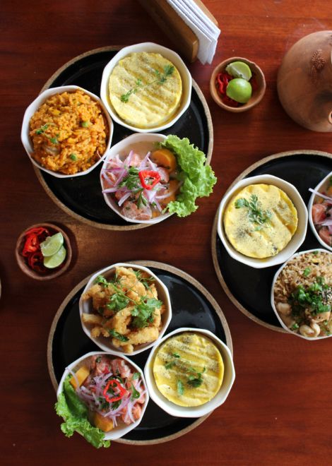 A trio of ceviche de trucha, Peruvian seafood rice, and causa limeña