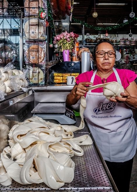 Quesillo, Oaxaca string cheese maker in the market