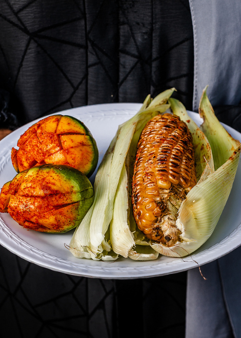 Simple grilled corn with chilli, lime and salt, hot off the charcoal grill 