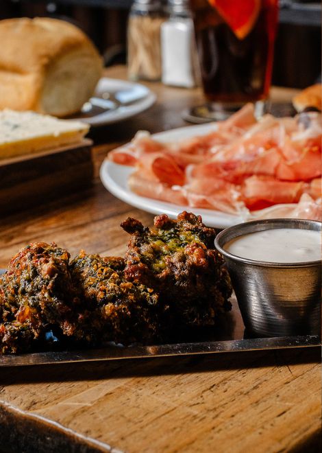 A simple pairing done right: house-cured ham and crisp, freshly fried chard fritters