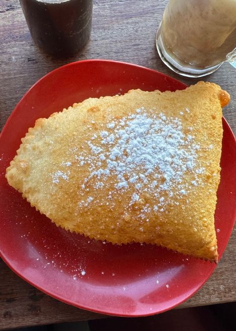 Crisp cheese pastel fritters dusted with sugar