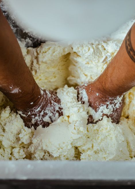 Fresh dough being kneaded for Medellín's beloved golden buñuelos.