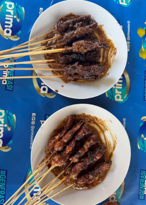 Balinese-style sate, smoky and charred from the coals.