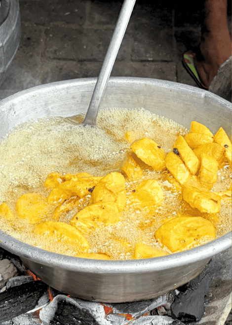 Fresh from the fryer in the heart of Makola Market.