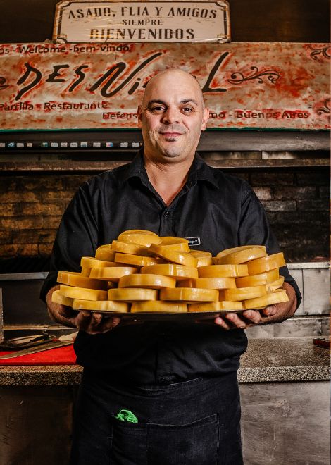 Wheels of provoleta awaits the grill