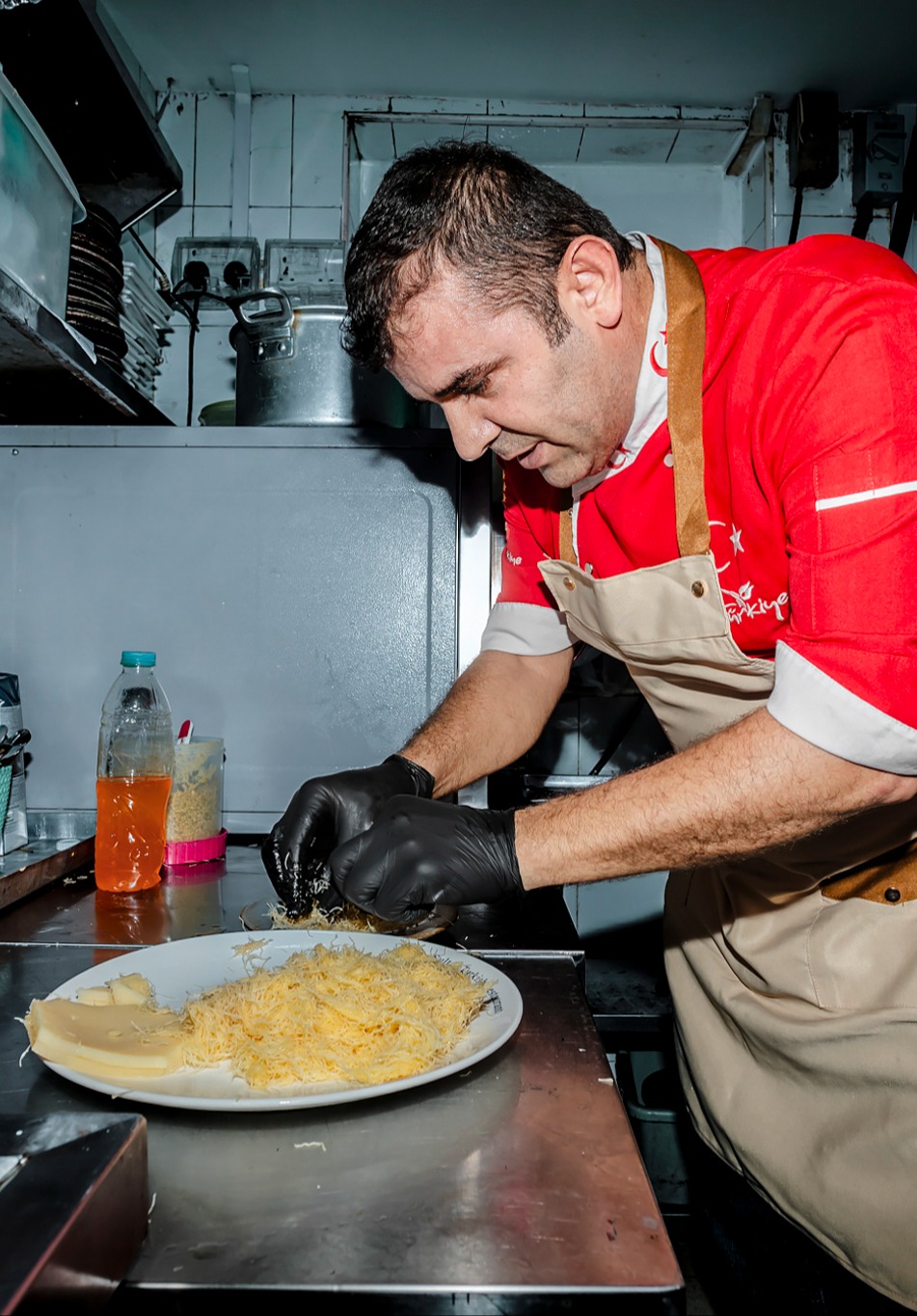 Chef Chemal preparing phyllo pastry dessert in his kitchen