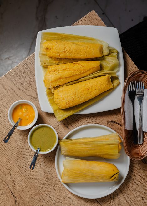 Warm humita, a traditional Ecuadorian steamed corn cake.