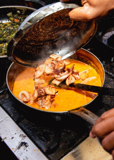 Rich ngisi wa nazi, calamari simmered in fragrant coconut curry.