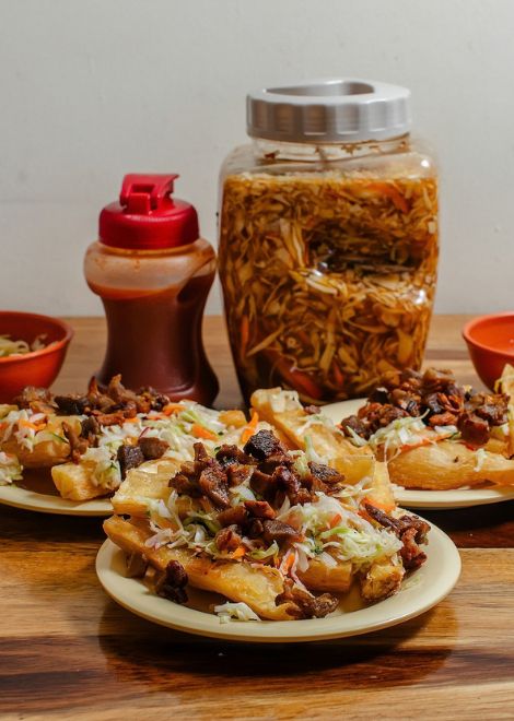 Yuca frita con chicharrón, a gloriously crispy Salvadoran classic.