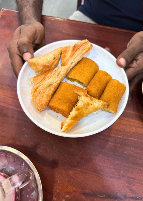 Golden chicken samosas paired with sweet, refreshing rose faluda.
